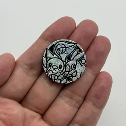 In hand, from Pokémon Coin Fan, full size