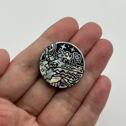 In hand, from Pokémon Coin Fan, full size