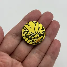 In hand, from Pokémon Coin Fan, full size