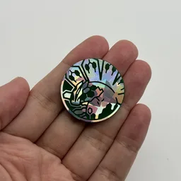 In hand, from Pokémon Coin Fan, full size