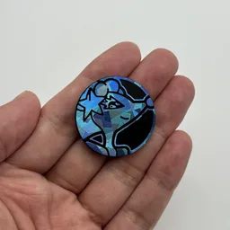 In hand, from Pokémon Coin Fan, full size