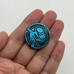 In hand, from Pokémon Coin Fan, full size