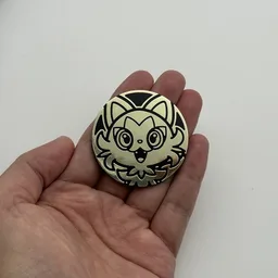 In hand, from Pokémon Coin Fan, full size