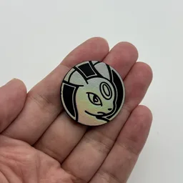 In hand, from Pokémon Coin Fan, full size