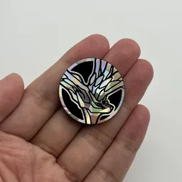 In hand, from Pokémon Coin Fan, full size