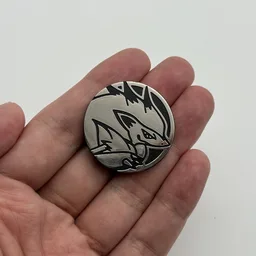 In hand, from Pokémon Coin Fan, full size