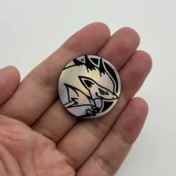 In hand, from Pokémon Coin Fan, full size