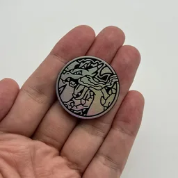 In hand, from Pokémon Coin Fan, full size