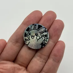 In hand, from Pokémon Coin Fan, full size