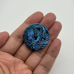 In hand, from Pokémon Coin Fan, full size