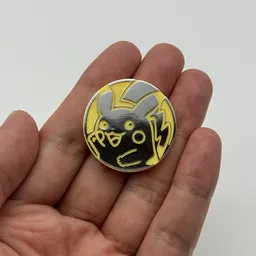In hand, from Pokémon Coin Fan, full size