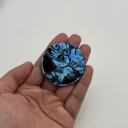 In hand, from Pokémon Coin Fan, full size