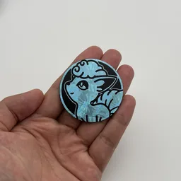 In hand, from Pokémon Coin Fan, full size