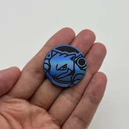 In hand, from Pokémon Coin Fan, full size