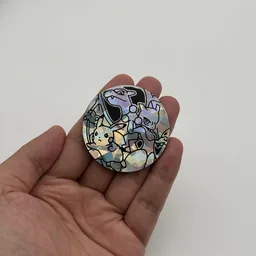 In hand, from Pokémon Coin Fan, full size
