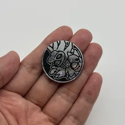 In hand, from Pokémon Coin Fan, full size