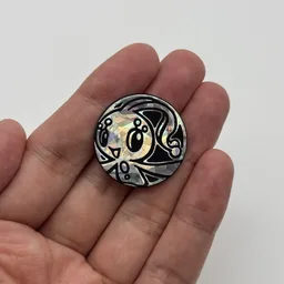 In hand, from Pokémon Coin Fan, full size
