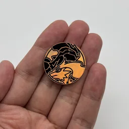 In hand, from Pokémon Coin Fan, full size