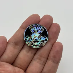 In hand, from Pokémon Coin Fan, full size
