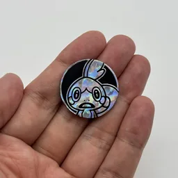 In hand, from Pokémon Coin Fan, full size