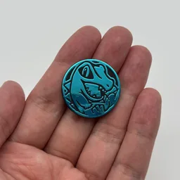 In hand, from Pokémon Coin Fan, full size
