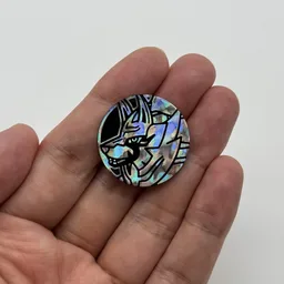 In hand, from Pokémon Coin Fan, full size
