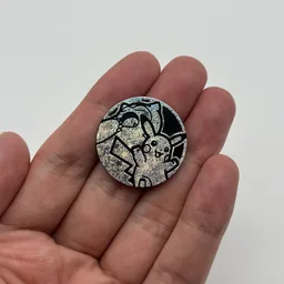 In hand, from Pokémon Coin Fan, full size
