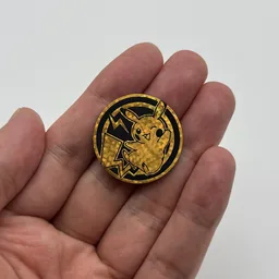In hand, from Pokémon Coin Fan, full size