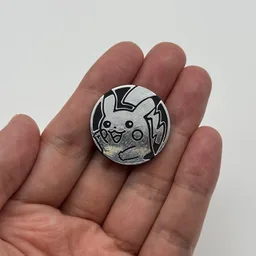 In hand, from Pokémon Coin Fan, full size
