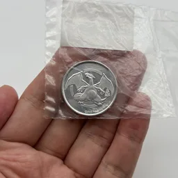 In hand, from Pokémon Coin Fan, full size