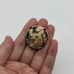 In hand, from Pokémon Coin Fan, full size