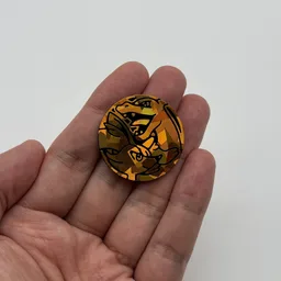 In hand, from Pokémon Coin Fan, full size