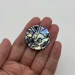 In hand, from Pokémon Coin Fan, full size