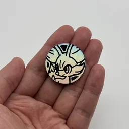 In hand, from Pokémon Coin Fan, full size