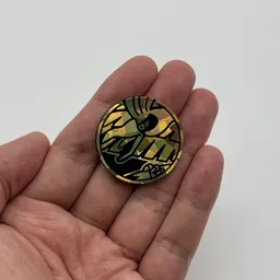In hand, from Pokémon Coin Fan, full size
