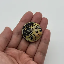 In hand, from Pokémon Coin Fan, full size