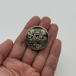 In hand, from Pokémon Coin Fan, full size