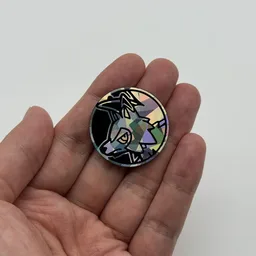 In hand, from Pokémon Coin Fan, full size