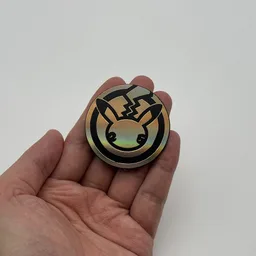 In hand, from Pokémon Coin Fan, full size