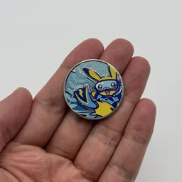 In hand, from Pokémon Coin Fan, full size