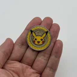 In hand, from Pokémon Coin Fan, full size
