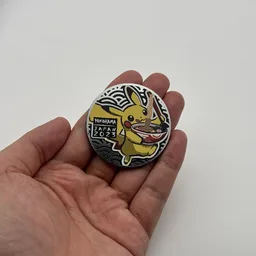 In hand, from Pokémon Coin Fan, full size