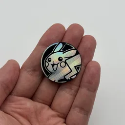 In hand, from Pokémon Coin Fan, full size