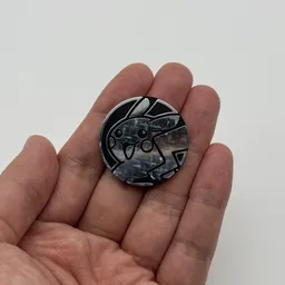 In hand, from Pokémon Coin Fan, full size