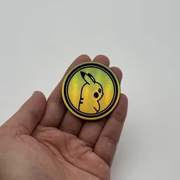 In hand, from Pokémon Coin Fan, full size