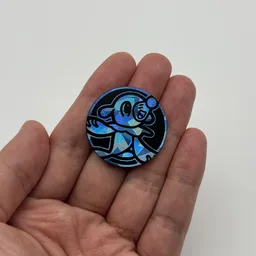 In hand, from Pokémon Coin Fan, full size