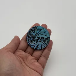 In hand, from Pokémon Coin Fan, full size