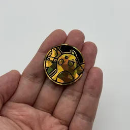 In hand, from Pokémon Coin Fan, full size