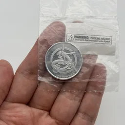 In hand, from Pokémon Coin Fan, full size