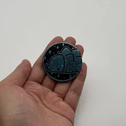 In hand, from Pokémon Coin Fan, full size
